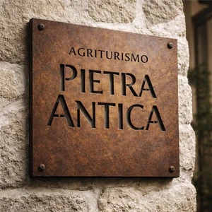 Illuminated sign in thick Corten steel